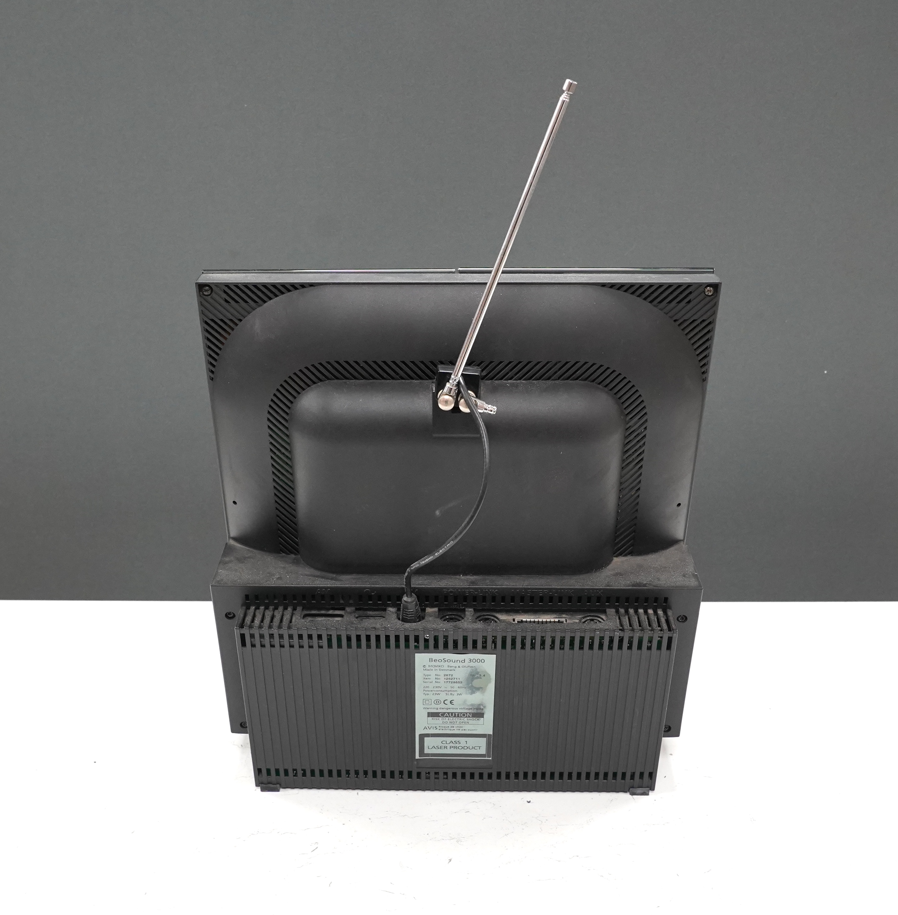 A Bang & Olufsen BeoSound 3000 CD player and music system, 37cm high, with instruction booklet, cables and remote control
